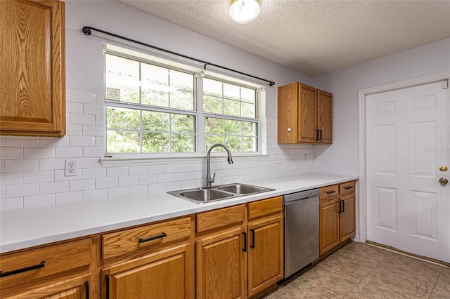 32 Karas Trl, Palm Coast, FL 32164 - kitchen with stainless steel dishwasher, a textured ceiling, brown cabinetry, light countertops, and decorative backsplash