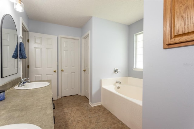 32 Karas Trl, Palm Coast, FL 32164 - full bath with a garden tub, vanity, and tile patterned floors