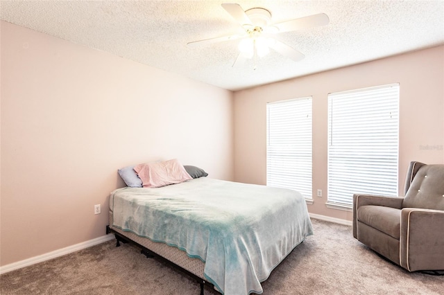 32 Karas Trl, Palm Coast, FL 32164 - carpeted bedroom featuring a textured ceiling and ceiling fan