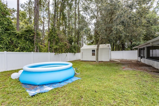 32 Karas Trl, Palm Coast, FL 32164 - fenced backyard featuring a sunroom, a storage shed, and view of wooded area