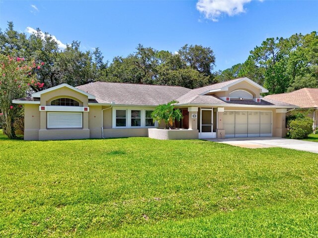5 Wilksboro Pl, Palm Coast, FL 32164 - single story home featuring an attached garage, driveway, a front lawn, and stucco siding