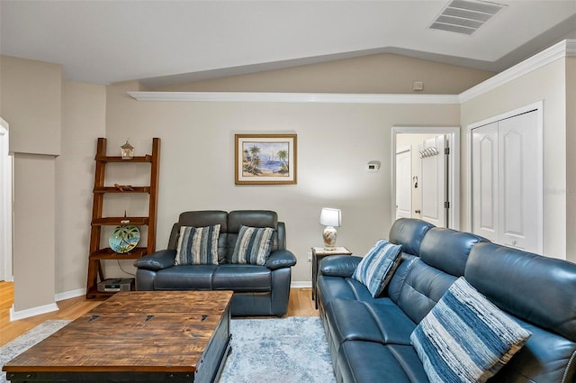 5 Wilksboro Pl, Palm Coast, FL 32164 - living room featuring light wood-style flooring, vaulted ceiling, and crown molding