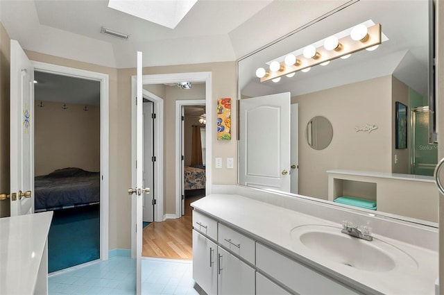 5 Wilksboro Pl, Palm Coast, FL 32164 - full bathroom featuring ensuite bath, tile patterned flooring, a skylight, and vanity