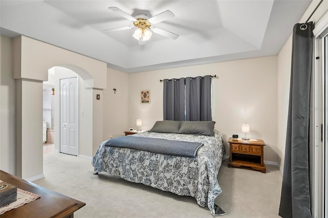 5 Wilksboro Pl, Palm Coast, FL 32164 - bedroom featuring light carpet, arched walkways, a raised ceiling, and a closet