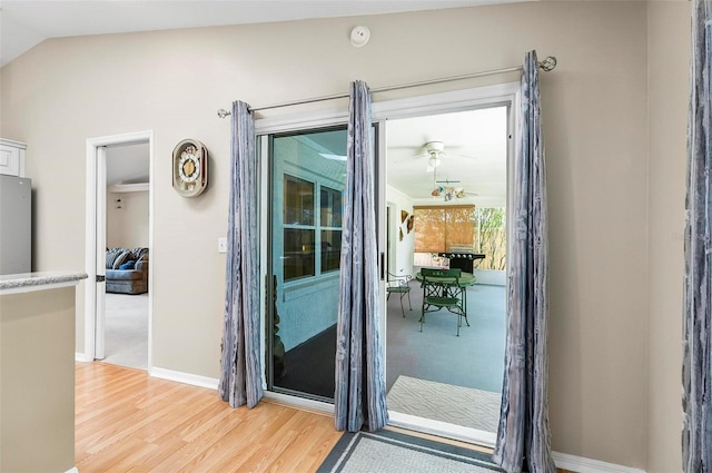 5 Wilksboro Pl, Palm Coast, FL 32164 - doorway to outside with light wood-style floors and lofted ceiling
