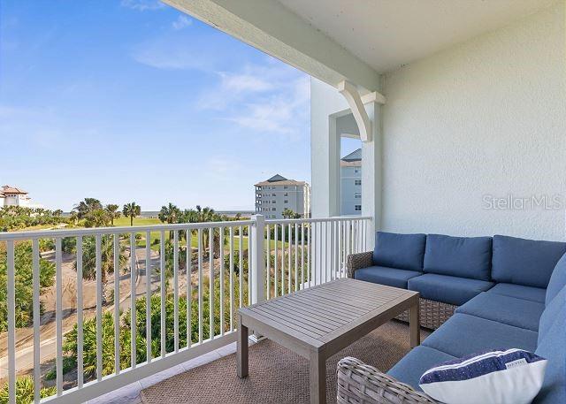 200 Cinnamon Beach Way Unit 131, Palm Coast, FL 32137 - balcony featuring an outdoor hangout area