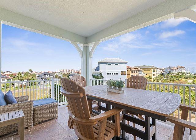 200 Cinnamon Beach Way Unit 131, Palm Coast, FL 32137 - balcony with a residential view and outdoor dining area
