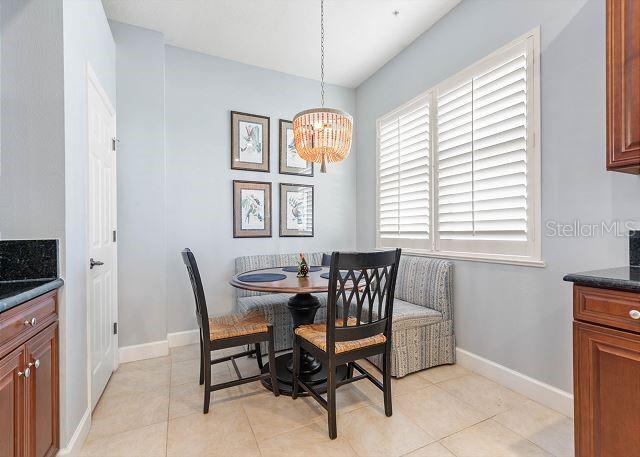 200 Cinnamon Beach Way Unit 131, Palm Coast, FL 32137 - dining space featuring a chandelier and light tile patterned floors
