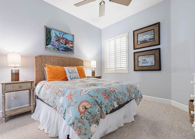 200 Cinnamon Beach Way Unit 131, Palm Coast, FL 32137 - bedroom with carpet flooring and ceiling fan