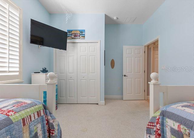200 Cinnamon Beach Way Unit 131, Palm Coast, FL 32137 - carpeted bedroom featuring a closet