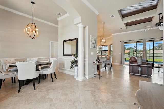 42 Felwood Ln, Palm Coast, FL 32137 - dining area with a chandelier, healthy amount of natural light, ornamental molding, decorative columns, and a ceiling fan