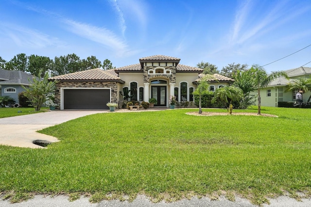 42 Felwood Ln, Palm Coast, FL 32137 - mediterranean / spanish house featuring french doors, stucco siding, a garage, and a front yard