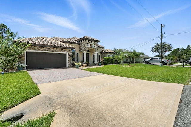 42 Felwood Ln, Palm Coast, FL 32137 - mediterranean / spanish home featuring a front yard, stone siding, driveway, an attached garage, and stucco siding