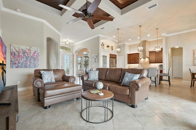 42 Felwood Ln, Palm Coast, FL 32137 - living area with arched walkways, light tile patterned flooring, a high ceiling, a ceiling fan, and recessed lighting