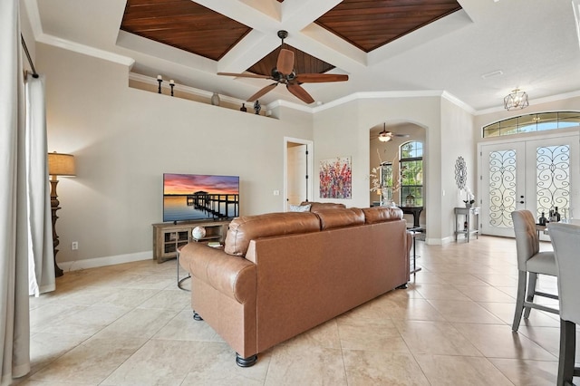 42 Felwood Ln, Palm Coast, FL 32137 - living area with a ceiling fan, coffered ceiling, crown molding, arched walkways, and beamed ceiling