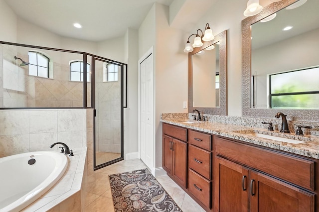 42 Felwood Ln, Palm Coast, FL 32137 - full bath featuring a bath, a shower stall, double vanity, recessed lighting, and tile patterned floors