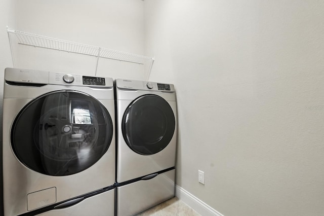 42 Felwood Ln, Palm Coast, FL 32137 - washroom featuring washer and clothes dryer and tile patterned floors
