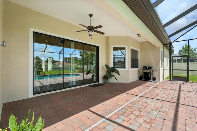 42 Felwood Ln, Palm Coast, FL 32137 - view of patio featuring a grill, glass enclosure, and a ceiling fan