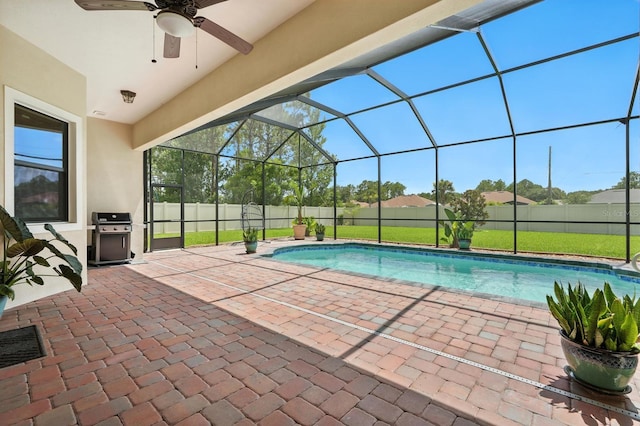 42 Felwood Ln, Palm Coast, FL 32137 - view of pool with a grill, a patio, a lanai, ceiling fan, and a fenced backyard