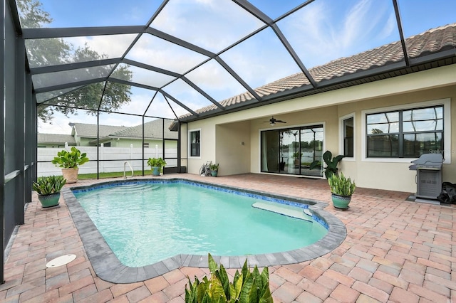 42 Felwood Ln, Palm Coast, FL 32137 - view of swimming pool with a patio area, a ceiling fan, glass enclosure, and a grill