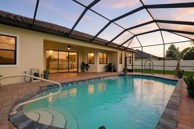 42 Felwood Ln, Palm Coast, FL 32137 - view of swimming pool featuring a patio area, a grill, a ceiling fan, and a lanai