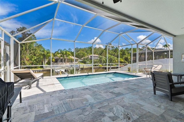 12 Comet Ct, Palm Coast, FL 32137 - swimming pool with a patio and glass enclosure