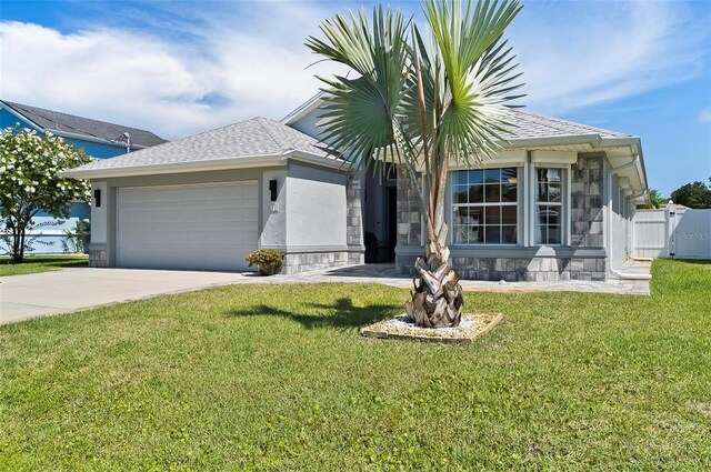 12 Comet Ct, Palm Coast, FL 32137 - ranch-style house featuring a garage, concrete driveway, stone siding, and stucco siding