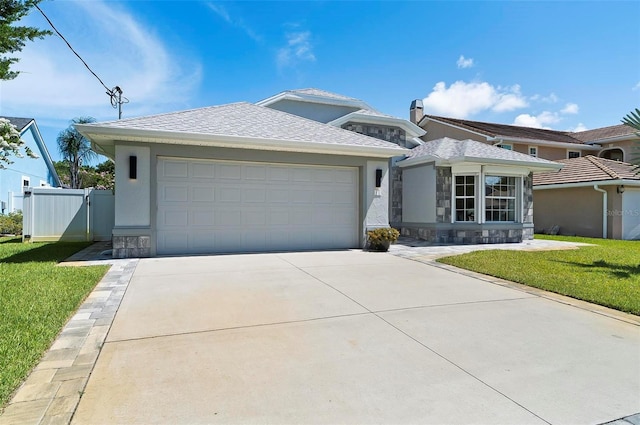 12 Comet Ct, Palm Coast, FL 32137 - view of front of property with stone siding, stucco siding, and driveway