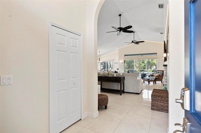 12 Comet Ct, Palm Coast, FL 32137 - entryway with lofted ceiling, a ceiling fan, arched walkways, and light tile patterned floors