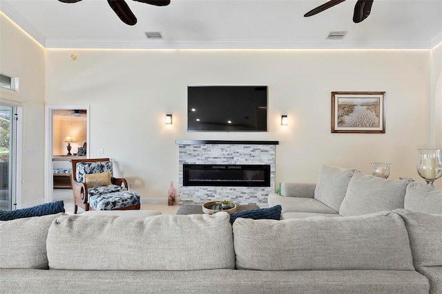 12 Comet Ct, Palm Coast, FL 32137 - living room with ceiling fan, crown molding, and a glass covered fireplace