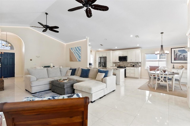 12 Comet Ct, Palm Coast, FL 32137 - living room featuring a chandelier, a ceiling fan, arched walkways, vaulted ceiling, and recessed lighting