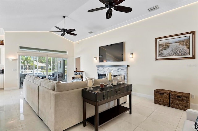 12 Comet Ct, Palm Coast, FL 32137 - living area with ceiling fan, light tile patterned flooring, high vaulted ceiling, and a fireplace