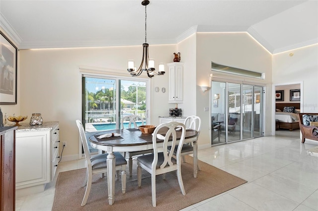 12 Comet Ct, Palm Coast, FL 32137 - dining space with ornamental molding, a chandelier, and light tile patterned floors