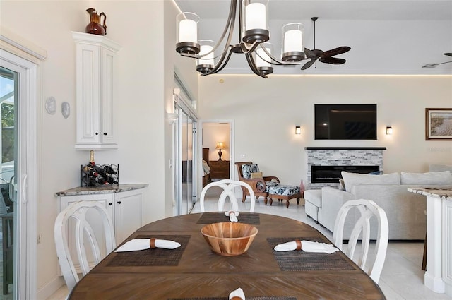 12 Comet Ct, Palm Coast, FL 32137 - dining room featuring a chandelier, a fireplace, and light tile patterned floors
