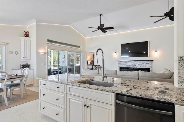 12 Comet Ct, Palm Coast, FL 32137 - kitchen with dishwasher, a ceiling fan, open floor plan, light tile patterned floors, and vaulted ceiling