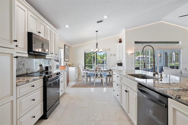 12 Comet Ct, Palm Coast, FL 32137 - kitchen featuring black appliances, lofted ceiling, a chandelier, light stone countertops, and tasteful backsplash