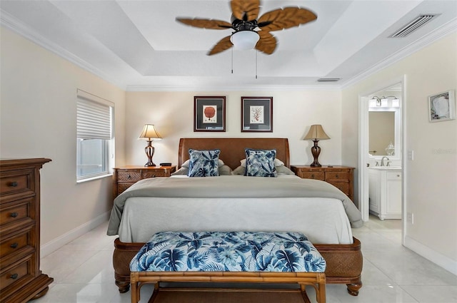 12 Comet Ct, Palm Coast, FL 32137 - bedroom featuring a tray ceiling, light tile patterned floors, ensuite bath, and crown molding