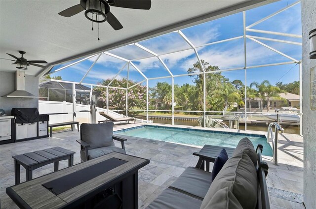 12 Comet Ct, Palm Coast, FL 32137 - swimming pool featuring a ceiling fan, a grill, a patio area, and an outdoor living space