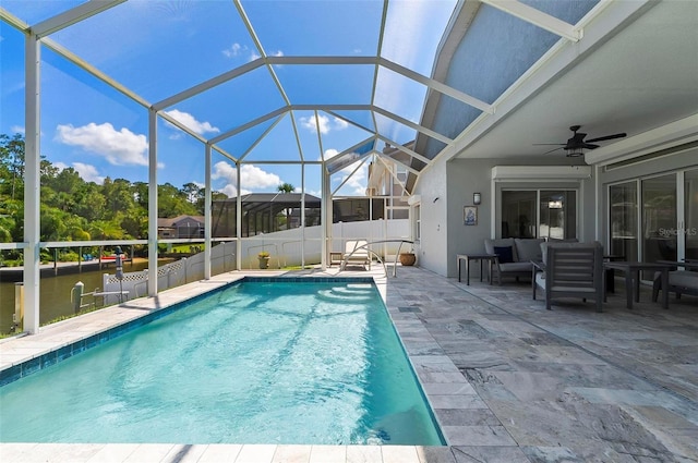 12 Comet Ct, Palm Coast, FL 32137 - view of pool featuring a patio, a ceiling fan, glass enclosure, and an outdoor hangout area