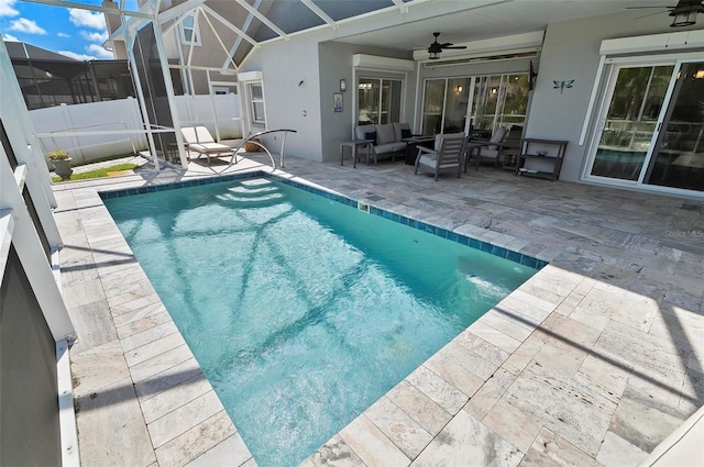 12 Comet Ct, Palm Coast, FL 32137 - view of swimming pool featuring a ceiling fan, a patio, an outdoor living space, and glass enclosure