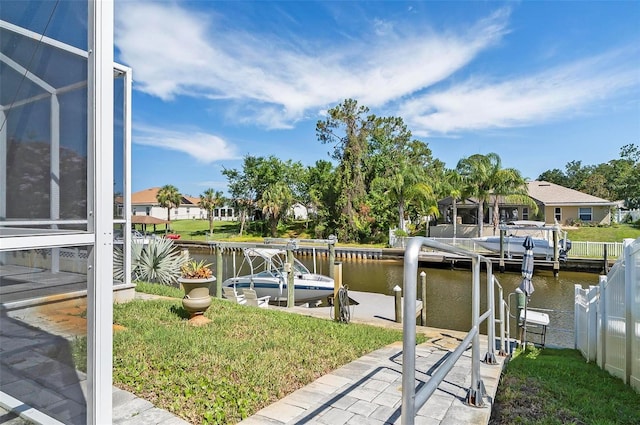 12 Comet Ct, Palm Coast, FL 32137 - dock area with boat lift, a water view, and a residential view
