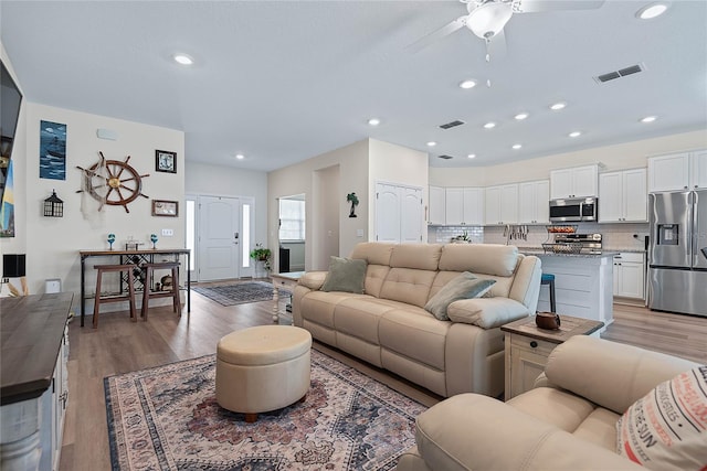 7 Pine Bush Ln, Palm Coast, FL 32164 - living area featuring a ceiling fan, light wood-style flooring, and recessed lighting