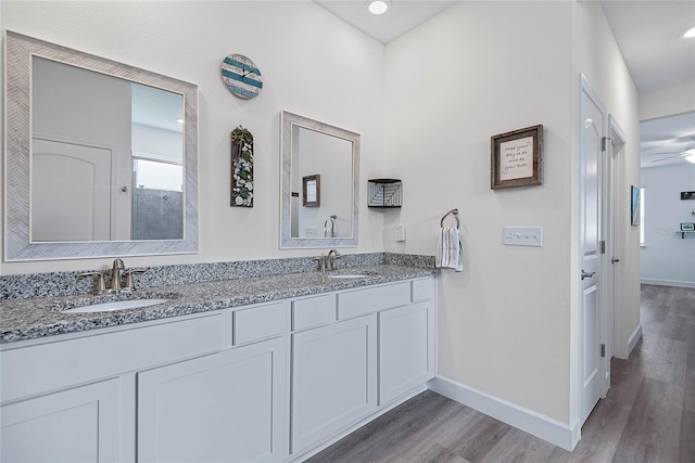 7 Pine Bush Ln, Palm Coast, FL 32164 - bathroom featuring double vanity and wood finished floors