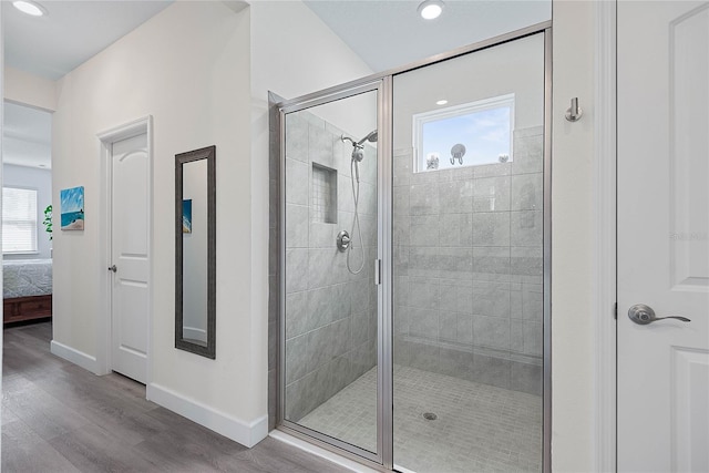 7 Pine Bush Ln, Palm Coast, FL 32164 - ensuite bathroom featuring wood finished floors, a shower stall, and recessed lighting
