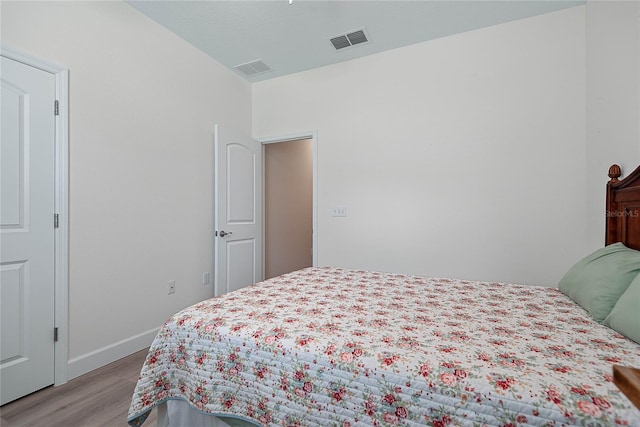 7 Pine Bush Ln, Palm Coast, FL 32164 - bedroom featuring light wood-type flooring and baseboards