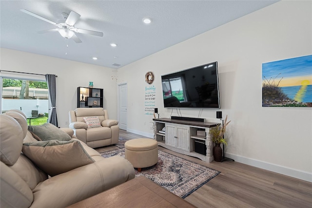 7 Pine Bush Ln, Palm Coast, FL 32164 - living room with wood finished floors, ceiling fan, and recessed lighting