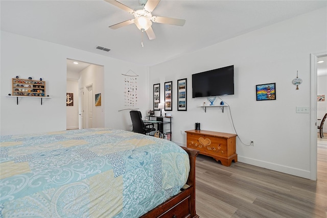 7 Pine Bush Ln, Palm Coast, FL 32164 - bedroom with light wood finished floors and ceiling fan