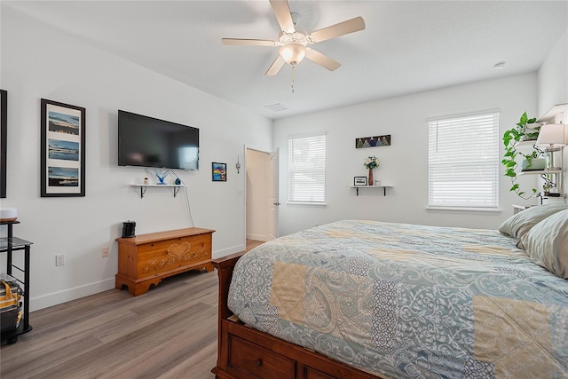 7 Pine Bush Ln, Palm Coast, FL 32164 - bedroom with light wood-type flooring and ceiling fan
