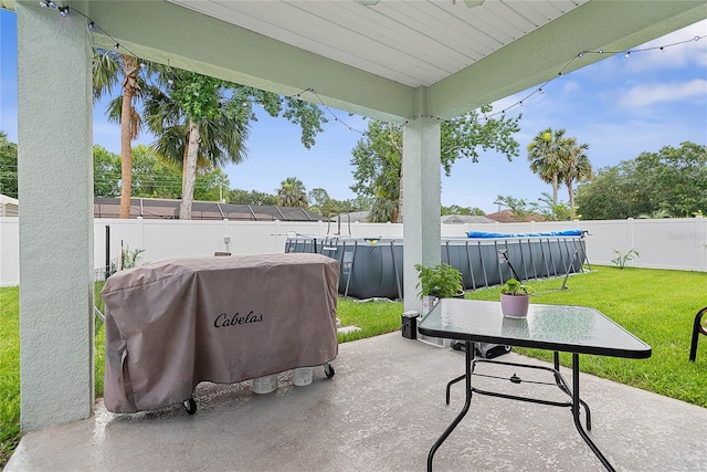 7 Pine Bush Ln, Palm Coast, FL 32164 - fenced backyard with grilling area and a patio area