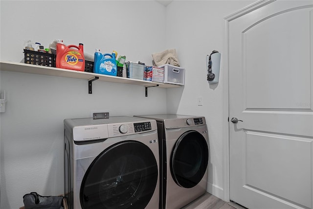 7 Pine Bush Ln, Palm Coast, FL 32164 - washroom with separate washer and dryer and light wood-type flooring